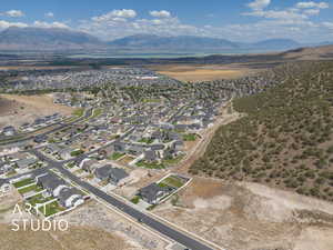 View of property location featuring nearby suburban area and a lake and mountain view