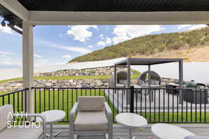 Wooden deck with a terraced lawn