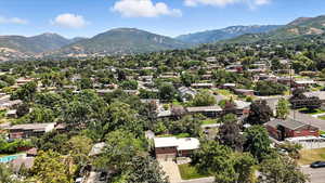 Aerial perspective of suburban area featuring a mountainous background