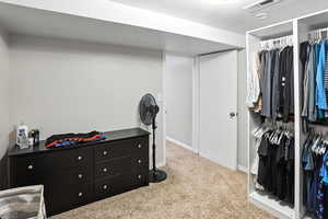 Bedroom featuring carpet flooring and baseboards