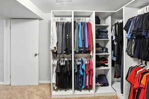 Spacious closet featuring carpet