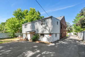 View of side of property featuring driveway