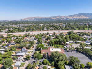 Aerial perspective of suburban area with a mountainous background