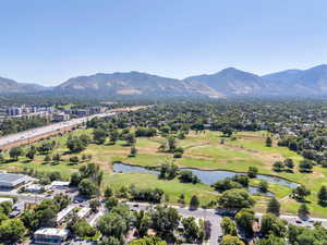 Bird's eye view of a golf club and a water and mountain view