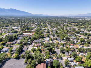 Aerial perspective of suburban area featuring a mountainous background