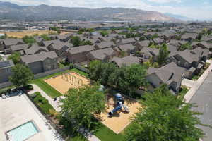 Aerial view of residential area featuring a mountainous background