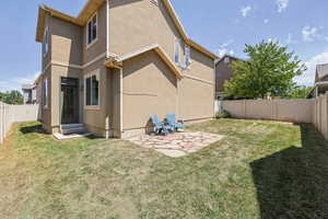 View of home's exterior with entry steps, a fenced backyard, and stucco siding
