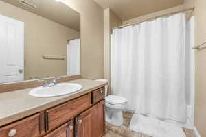 Bathroom featuring vanity and tile patterned flooring