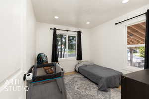 Bedroom featuring recessed lighting and wood finished floors