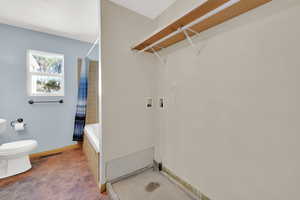 Laundry room featuring baseboards and hookup for a washing machine