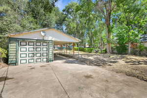 Garage featuring concrete driveway