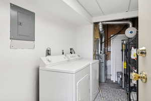 Washroom with washer and dryer and electric panel