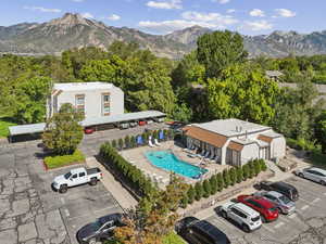 Drone / aerial view of a pool and a mountainous background