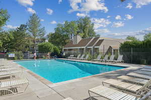 Community pool featuring a patio area