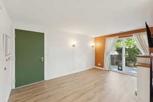 Spare room with wood finished floors and baseboards