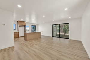 Unfurnished living room featuring recessed lighting and light wood-style floors