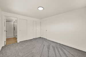 Unfurnished bedroom with carpet floors and a closet