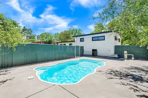 View of pool featuring a fenced backyard and a patio area
