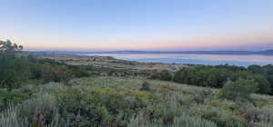 View of mountain backdrop featuring a nearby body of water