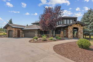 Front of home with 4 car garage and spacious driveway - cul de sac location