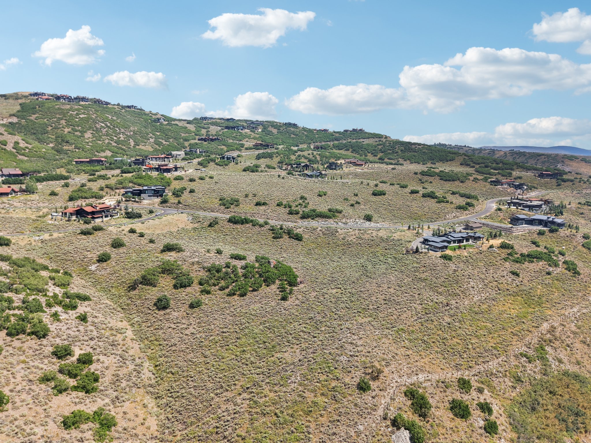 Overview of rural landscape featuring a mountain backdrop