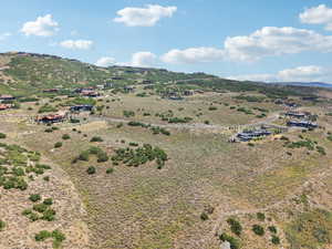 Overview of rural landscape featuring a mountain backdrop