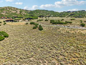 View of mountain backdrop featuring rural landscape