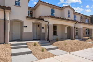 Mediterranean / spanish-style home featuring stucco siding and a tile roof