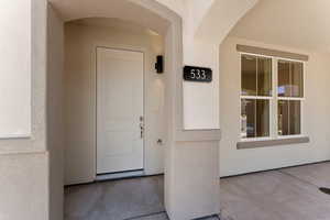 Property entrance with stucco siding
