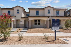 Mediterranean / spanish-style house featuring stucco siding and a tile roof