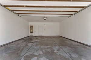 Garage with secured water heater and baseboards