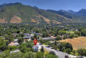 Aerial view of residential area featuring a mountainous background
