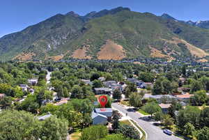 Aerial perspective of suburban area with a mountain backdrop