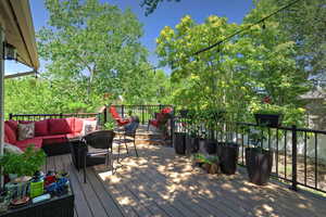 Wooden deck with an outdoor living space