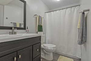 Bathroom with vanity, tile patterned floors, a shower with curtain, and a textured ceiling
