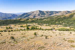 View of mountain backdrop featuring rural landscape