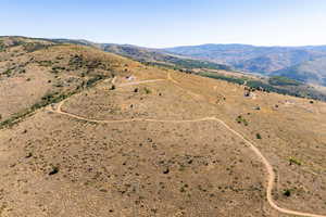 Aerial view of sparsely populated area featuring a mountainous background