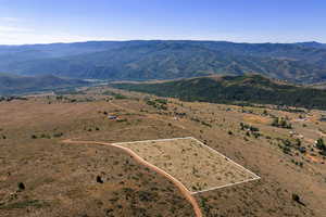 View of rural area with property boundaries highlighted and mountains