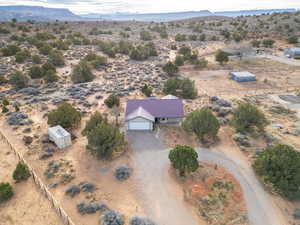 Overview of rural landscape with a desert landscape and a mountain backdrop