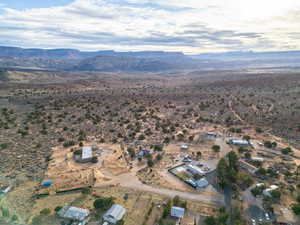 Aerial view of property's location featuring mountains and rural landscape