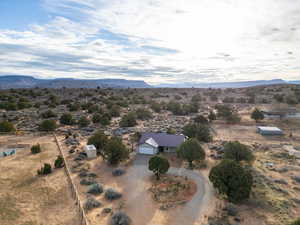 Overview of rural landscape with a desert landscape and a mountain backdrop