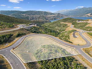 View of property location with property parcel outlined and a water and mountain view