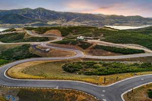 View of mountain backdrop with a nearby body of water