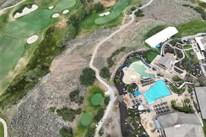Aerial overview of property's location featuring a golf club and a pool