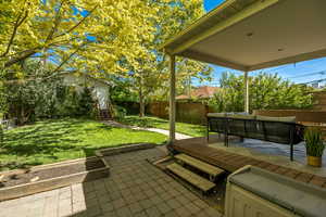 Fenced backyard with entry steps, outdoor lounge area, and a patio area