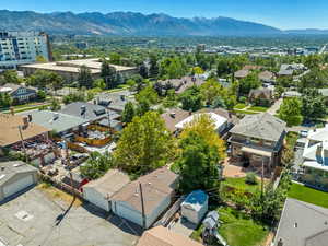 Aerial perspective of suburban area with a mountainous background