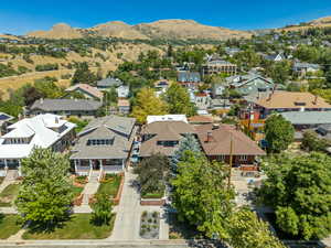 Aerial perspective of suburban area with a mountain backdrop
