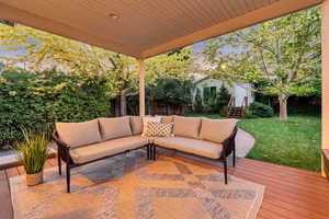Wooden deck featuring an outdoor living space
