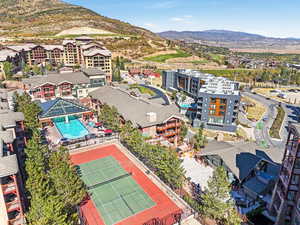 Aerial view of a mountainous background and a pool area