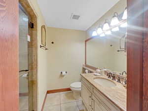Bathroom with vanity and tile patterned flooring